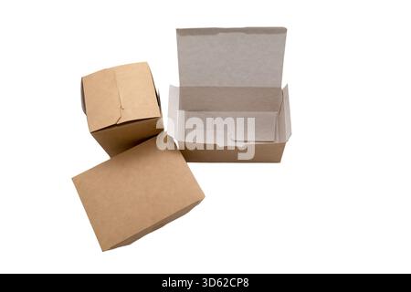 Three self-assembled boxes of different designs made of unpainted cardboard for food with a laminated inner layer, highlighted on a white background Stock Photo