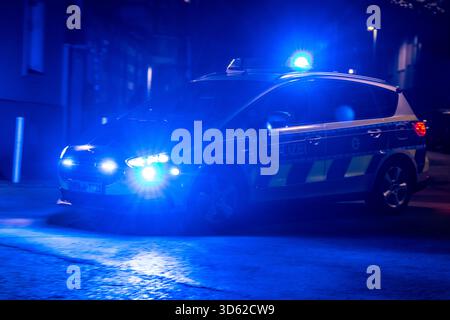 Police patrol car with blue lights in action, Essen, North Rhine-Westphalia, Germany Stock Photo