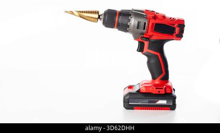 Modern red drill screwdriver with step drill bit in keyless chuck on white background, industry Stock Photo