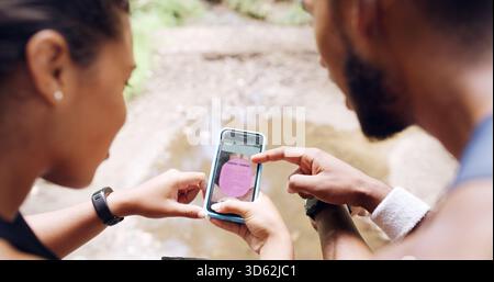 Hands, people and phone screen with personal trainer, outdoor and point for exercise program on ui. Coach, client and smartphone with scroll, info and Stock Photo