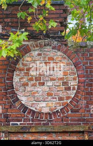 bricked-up round window of an old brick ruin, Germany, North Rhine-Westphalia, Ruhr Area, Witten Stock Photo