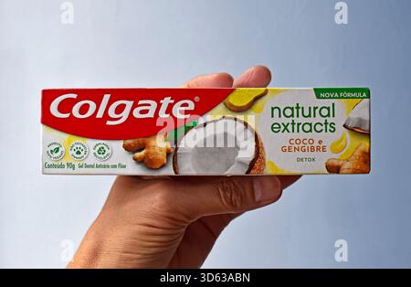 RIO DE JANEIRO, BRAZIL - November 17, 2025: Hand holding a toothpaste box Stock Photo