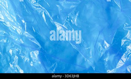Crumpled Light Blue Plastic Bag Texture with Wrinkles and Shine Background Stock Photo