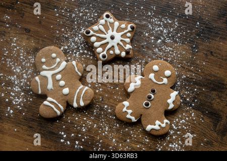 Cozy Christmas Flat Lay with Gingerbread Cookies on Rustic Wood Background Stock Photo