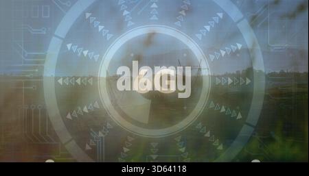 Projecting transparent HUD overlay over rural grassy field, showing central 6G text and power lines Stock Photo