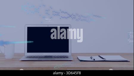 Displaying silver laptop centered on wooden desk at home, with mug, notebook, blue overlays Stock Photo