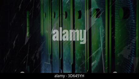 Glowing vertical server racks emitting green light in server room aisle, showing vented slots, LEDs Stock Photo