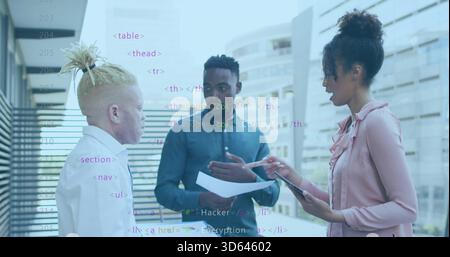 Discussing team in teal shirt pink blouse white shirt on office terrace, tablet papers code overlay Stock Photo