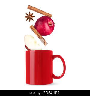 Health boosting drink for cold season. Apples, cinnamon and anise falling into cup on white background Stock Photo