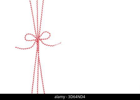 Red and White String Rope with Bow Isolated on White Background Stock Photo