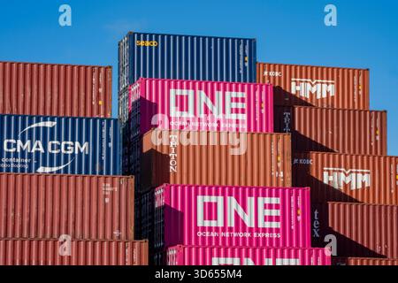 Stack of colourful shipping containers stored ready for export in Southampton docks, UK. Containers stacked in the docks at Southampton, UK Stock Photo