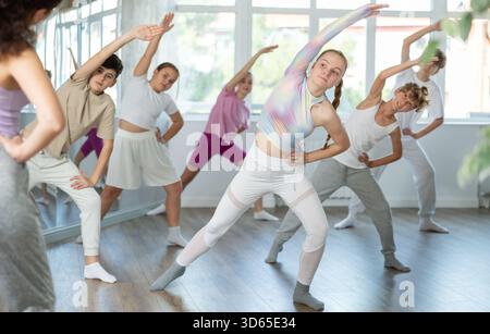 Group of children warming up before dance class Stock Photo