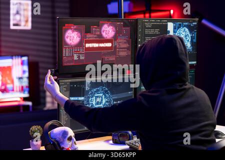 Hacker inserting flash drive in PC to bypass security using exploit, doing covert operations. Rogue technician penetrating firewalls using malware on USB stick, getting system hacked popup on display Stock Photo