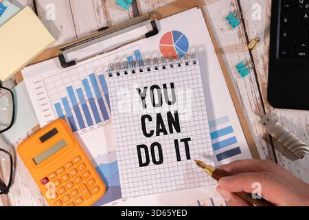 You can do it symbol. Concept word You can do it on beautiful big white billboard. Beautiful blue sky cloud background. Business motivational you can Stock Photo