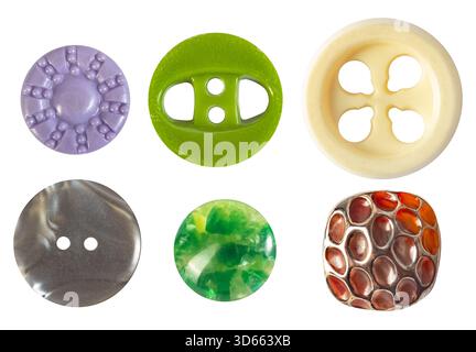 Isolated photo of various colored vintage glass and plastic cloth buttons on white background. Stock Photo