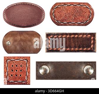 Isolated photo of various brown leather patches with stitch borders and rivets or studs on white background. Stock Photo