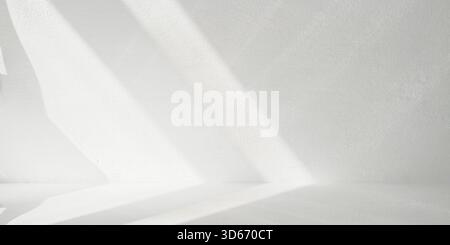 bright textured white wall and floor meeting clear corner seam. Surface has fine, granular finish, resembling plaster or cement. Strong diagonal shado Stock Photo