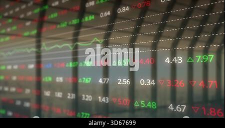 Displaying transparent ticker on glass in office, showing floating numbers with green red arrows Stock Photo