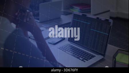 Rubbing temples man in casual shirt at dim office desk, viewing laptop terminal, phone, copy space Stock Photo