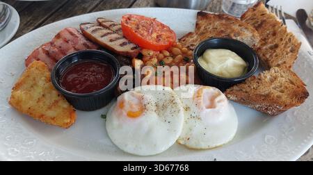 Full English Breakfast Served on white plate Stock Photo