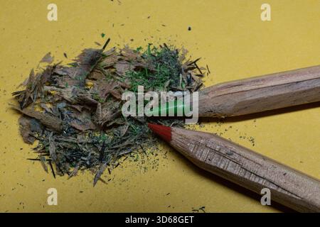 wooden crayons of different colors with wood chips in close up Stock Photo
