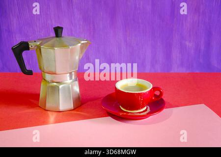 Espresso cup with saucer on two tone background with delicious fresh brewed espresso coffee. Free copy space. Stock Photo