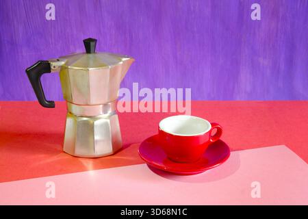 Espresso cup with saucer on two tone background with delicious fresh brewed espresso coffee. Free copy space. Stock Photo