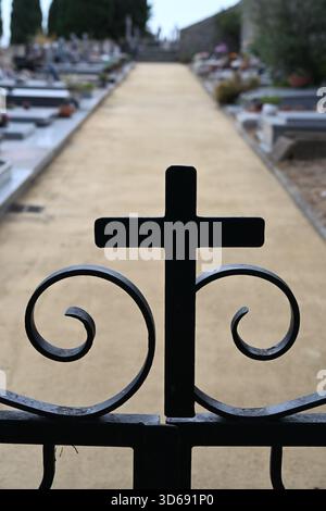 Chritian Cross Integrated into Wrought Iron Gate or Entrance and Path in Cemetery Cabris Alpes-Maritimes France Stock Photo