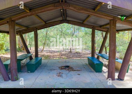 Photograph of an old semi abandoned wooden picnic shelter located in a forest in the Blue Mountains, NSW, Australia. Stock Photo