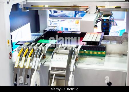 Modern automatic electronic component insertion machine Stock Photo