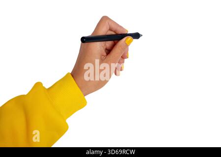 Female hand in yellow sleeve holding stylus pen, isolated on white, ready to write or draw. Modern digital creativity and technology concept. Stock Photo