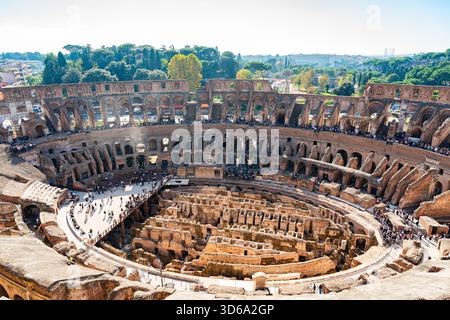 Panoramic interior view of the Colosseum in Rome, Italy, with the full circular arena and the exposed underground structures. Stock Photo