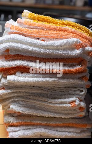 A view of a stack of folded small cloth towels. Stock Photo