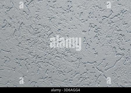 Textured gray stucco wall background with rough plaster pattern for design and decoration Stock Photo