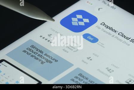 Dhaka, Bangladesh- 30 Oct 2025: Dropbox app on a iPad screen with a pen pointing at the install option Stock Photo