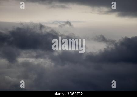 Dark storm clouds over a grey sky Stock Photo