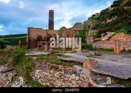 Porth Wen derelict brickworks with overgrown structures Stock Photo