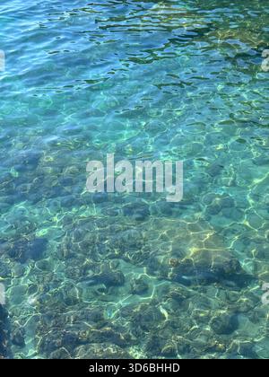 Crystal clear turquoise sea water surface Stock Photo