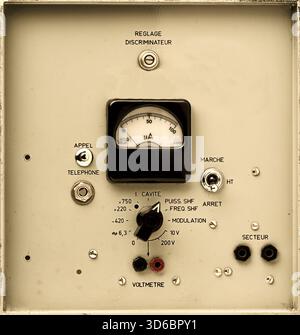 vintage electronic control panel detail with analog rotary dial, switchs and meter Stock Photo