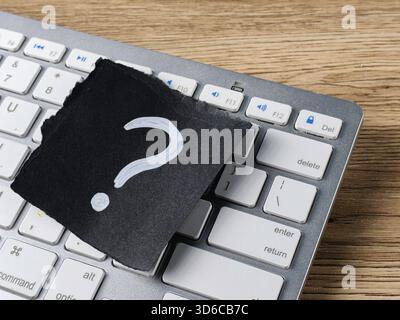 Technical Support Question Concept with Question Mark on Computer Keyboard for Online Help and Troubleshooting Stock Photo