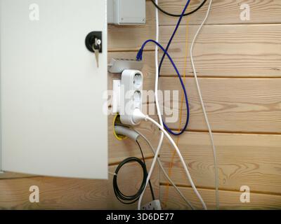 a temporarily maintained internet and electricity connections, indoor close up Stock Photo