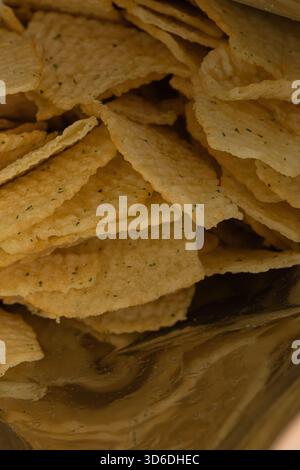 Extreme Macro Texture of Ruffled Potato Chips with Green Seasoning Stock Photo