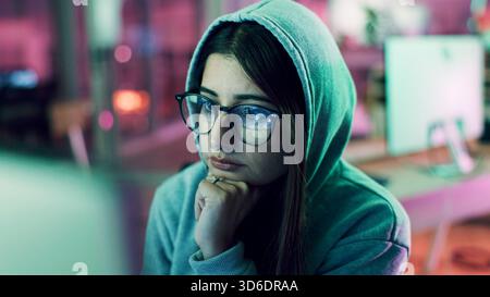 Night, hacking or woman with computer for encryption breach, firewall attack or cybersecurity crisis. Confidential info, system access or it Stock Photo