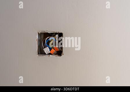 push in wire connectors sticking out of a wall socket Stock Photo