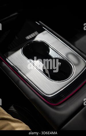 Plastic cup holders in the center console of a new, modern car. Close up, top down view, no people Stock Photo