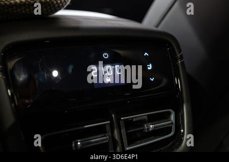 Modern car rear passenger screen with climate control functions. Close up shot, no people Stock Photo