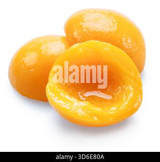 Peeled canned peach halves isolated on white background. File contains clipping paths. Stock Photo