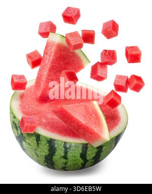 Cross cut of watermelon and watermelon cubes and pieces falling on it isolated on white background. File contains clipping paths. Stock Photo