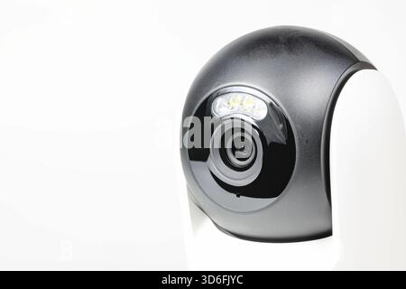 close-up shot lens of home security camera on white background. Stock Photo
