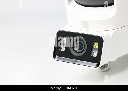 close-up shot lens of home security camera on white background. Stock Photo